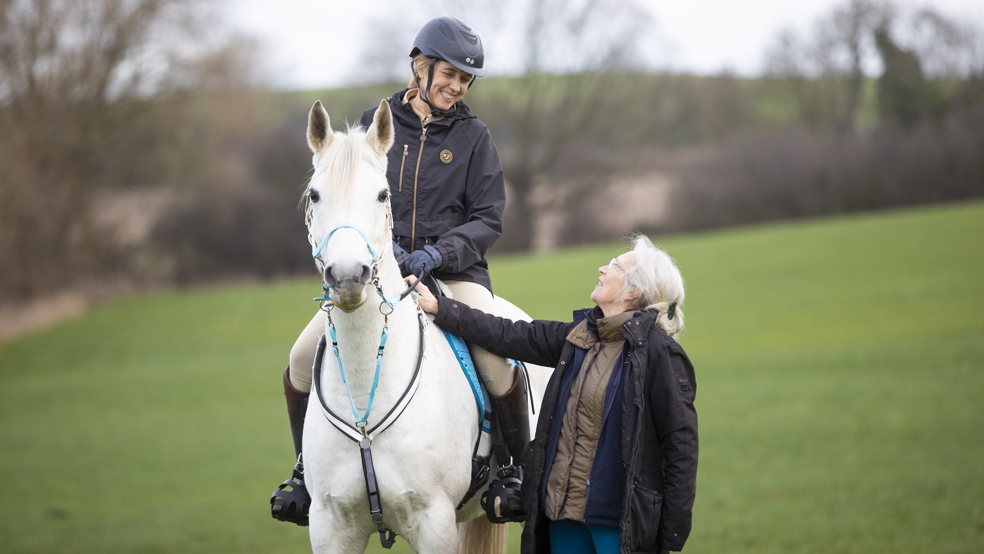 Emma Martin riding grey horse Nightfire Hallelujah Louis with her mother Julie