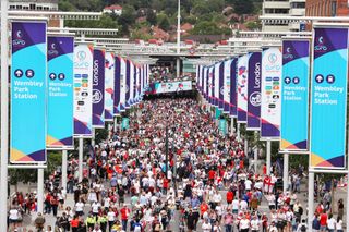 Fans walk down Wembley way prior tog the UEFA Women's Euro 2022 final match between England and Germany at Wembley Stadium on July 31, 2022 in London, England.