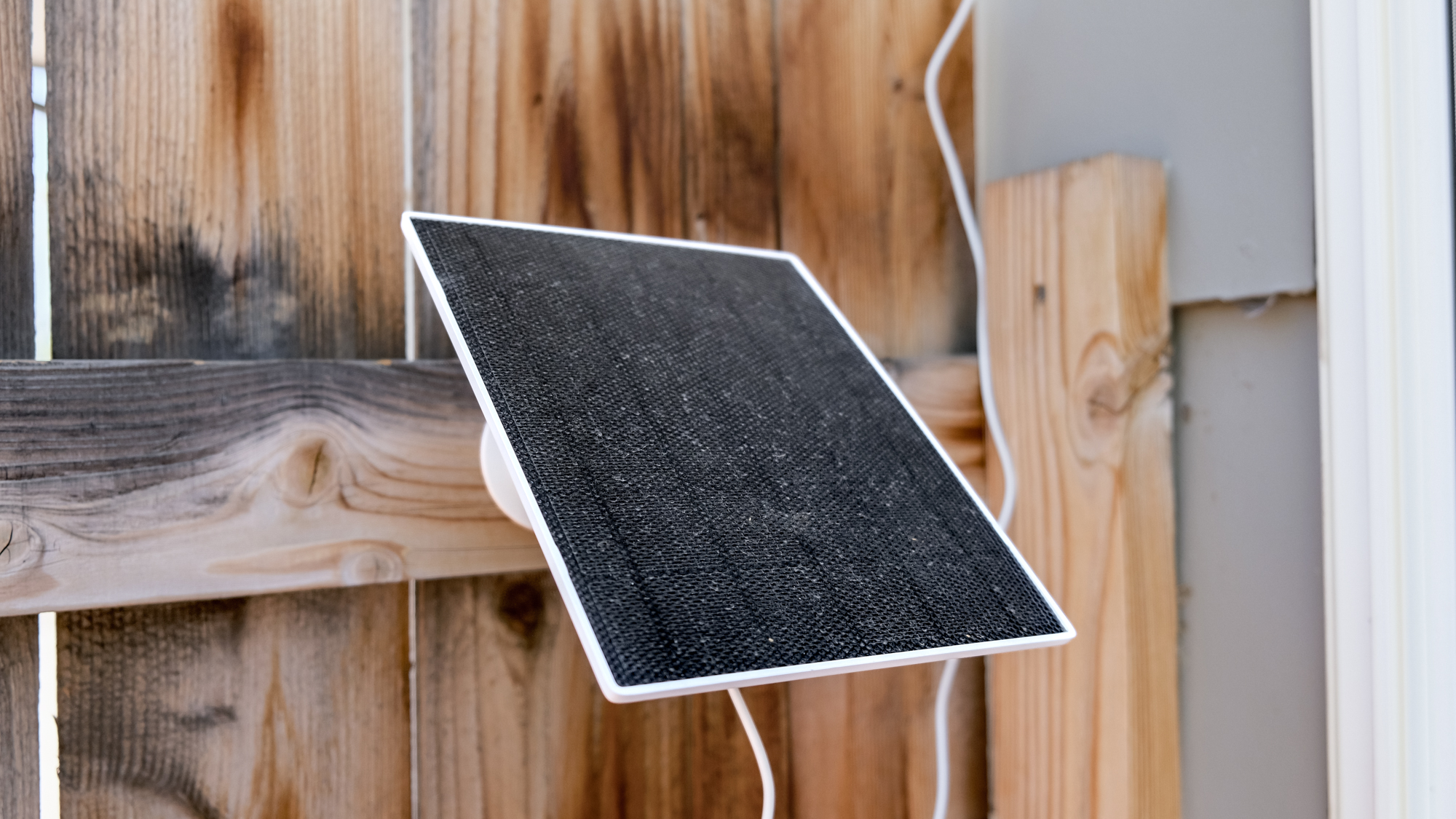 Solar panel for the TP-Link Tapo C675D security camera mounted to a fence