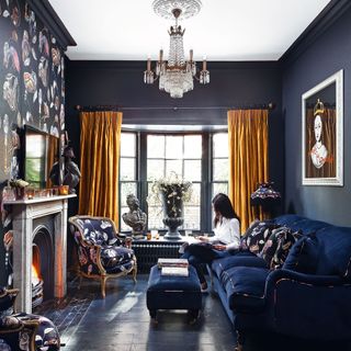 Bold dark blue living room with matching sofa and floor