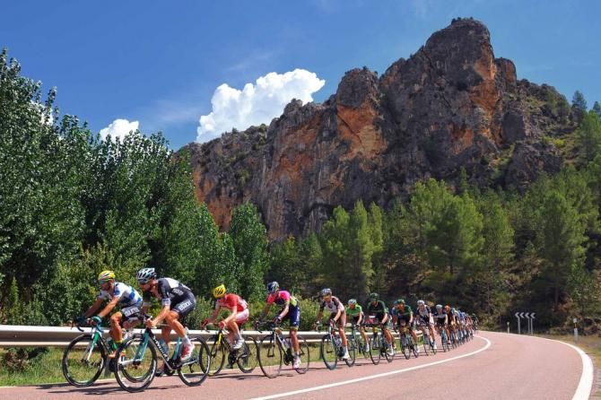 The peloton under blue skies before the rain set in