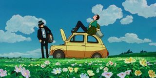 Lupin sitting on a car in Lupin The Third: The Castle of Cagliostro