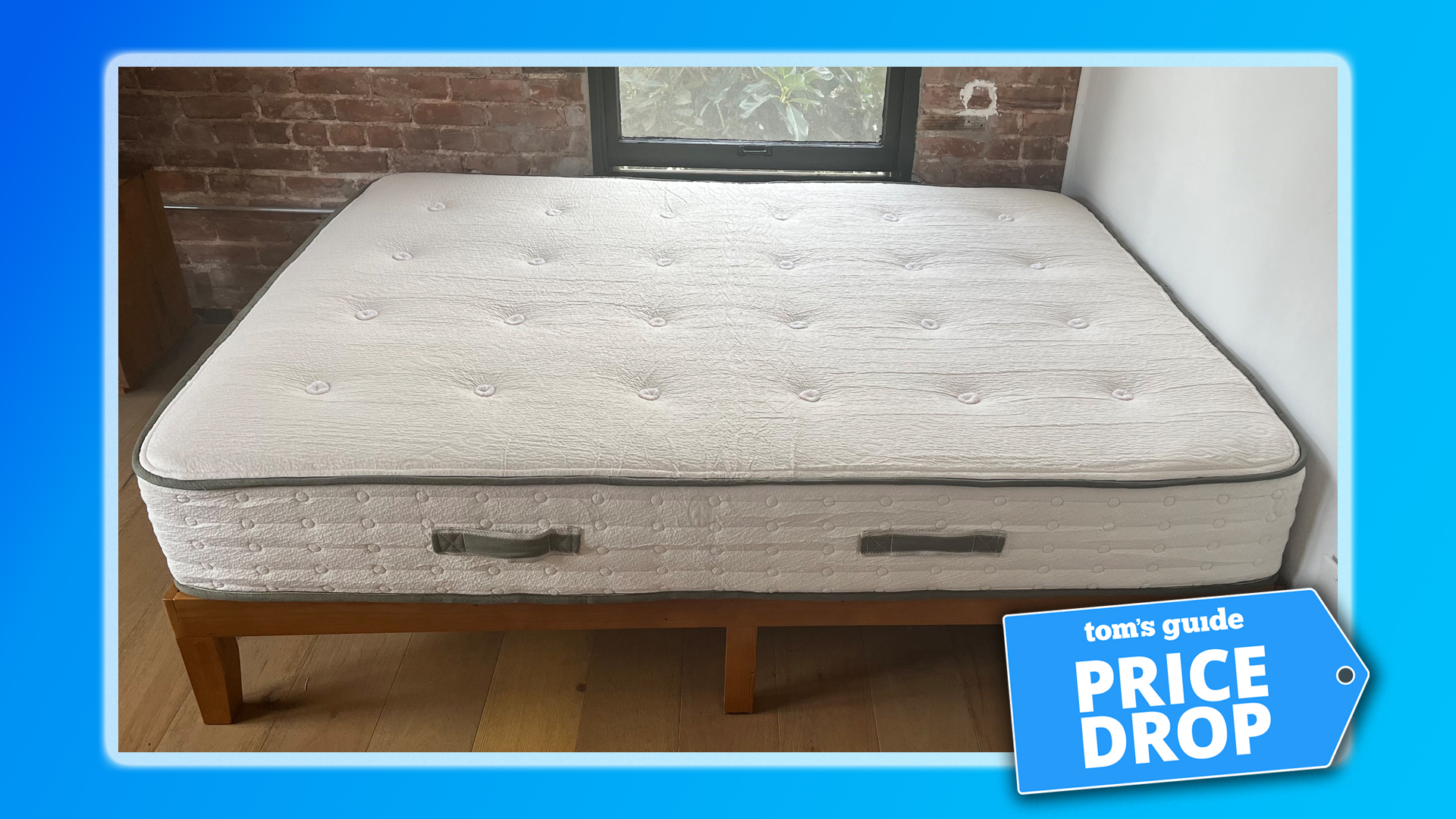 The Avocado Green Mattress on a bed frame in our reviewer's bedroom, with a blue border. In the bottom right corner is a Tom's Guide Price Drop deals badge