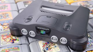 A Nintendo 64 system on top of a pile of N64 games