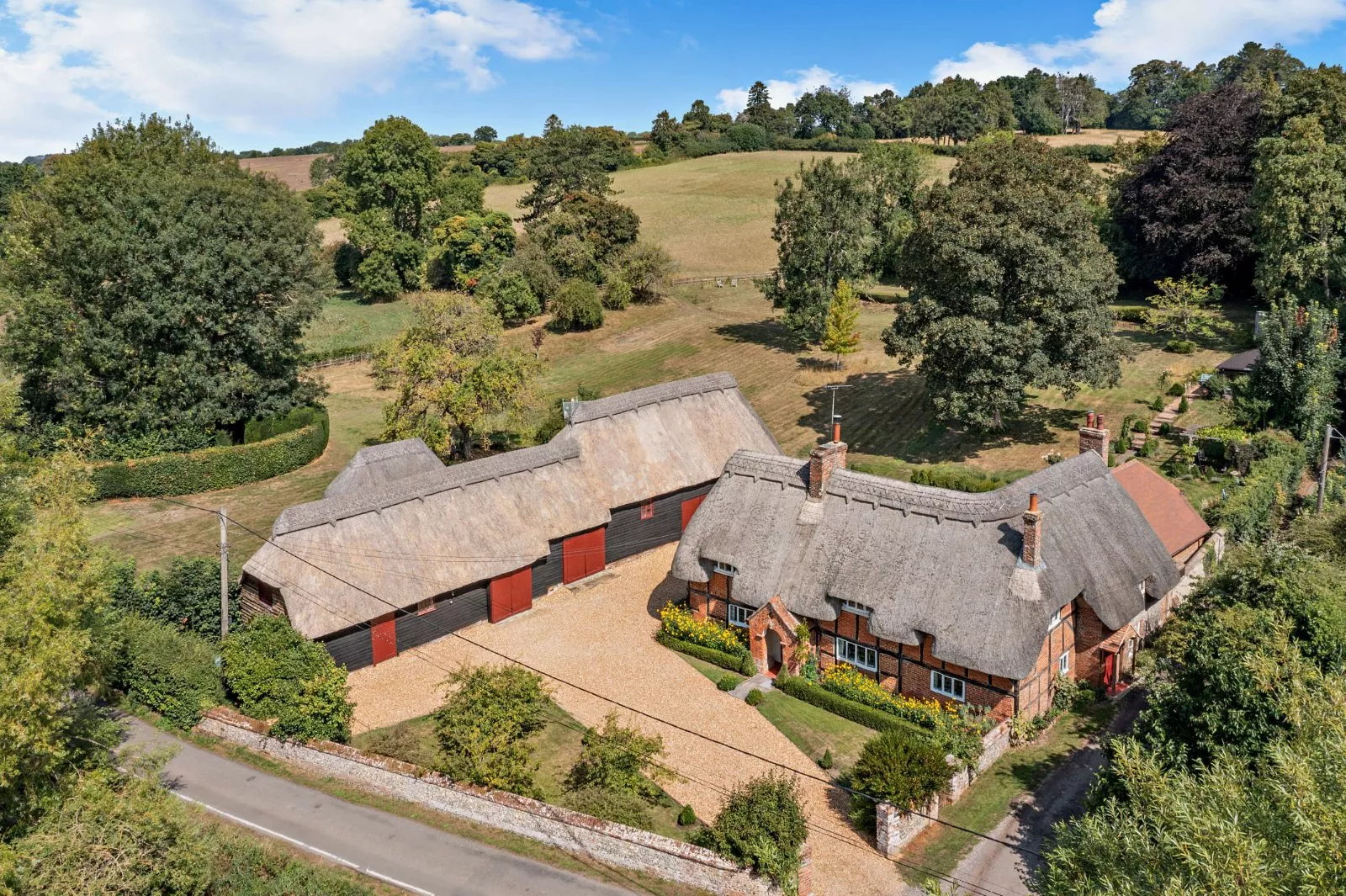 Aerial view of a thatched cottage in Hampshire