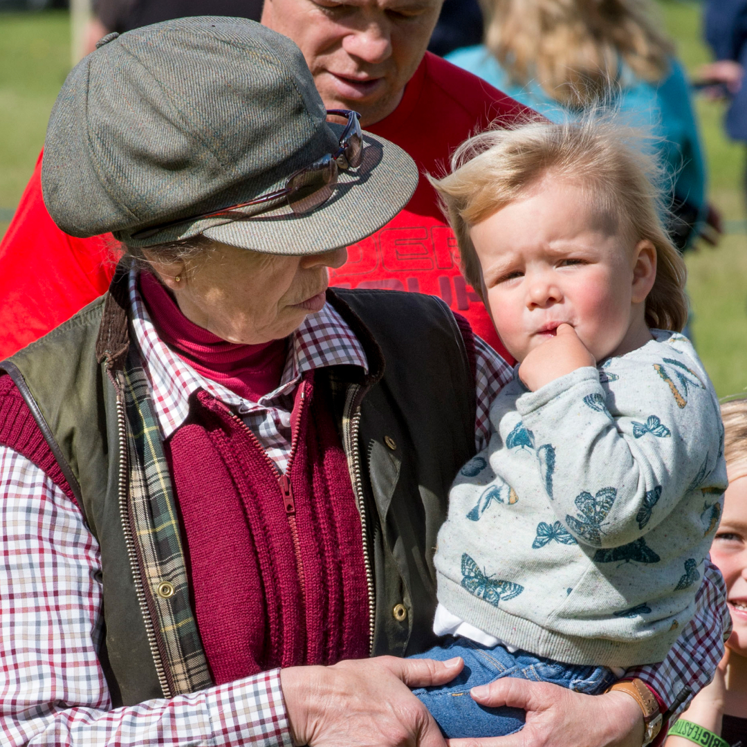Princess Anne holding Mia Tindall