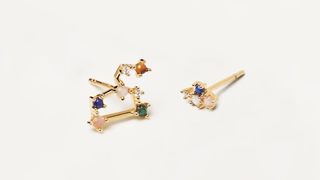 A pair of constellation zodiac earrings, one of the best personalized jewelry gifts.