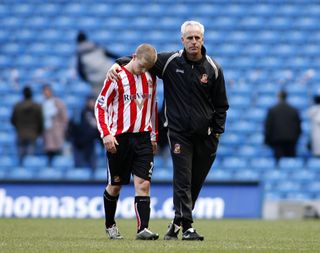 Mick McCarthy, right, and Grant Leadbitter walk off dejected after Sunderland's defeat to Manchester City in 2005-06