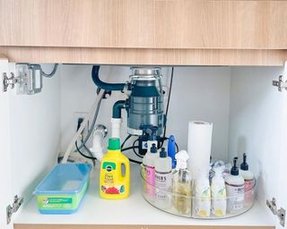 Under the sink storage using a Lazy Susan style spin board