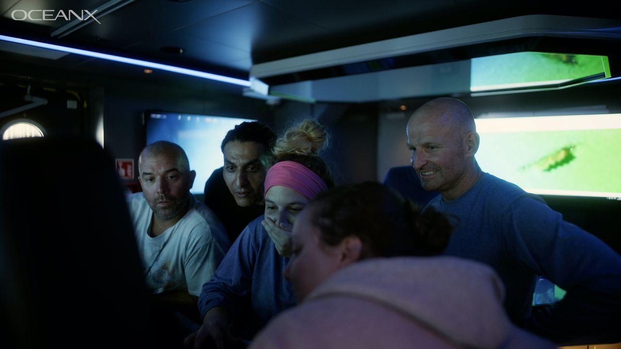 The OceanX crew are stunned when they see the footage of the big squid.