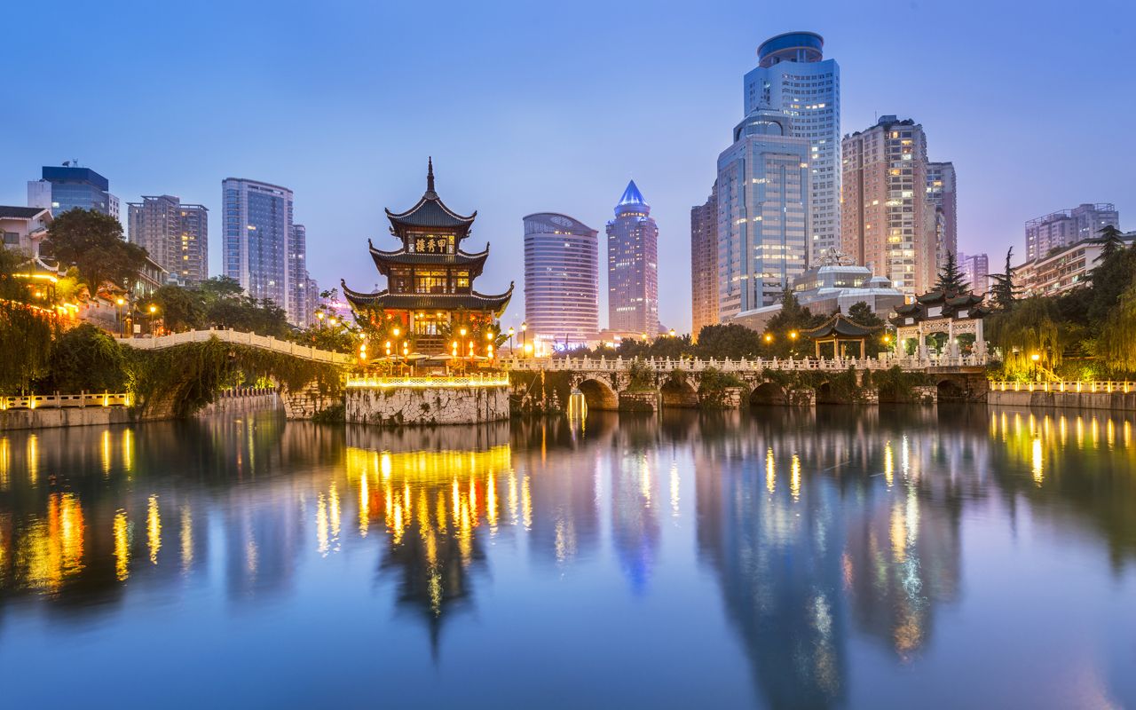 Cityscape of Guiyang at night, Jiaxiu Pavilion on the Nanming River. Located in Guiyang City, Guizhou Province, China.