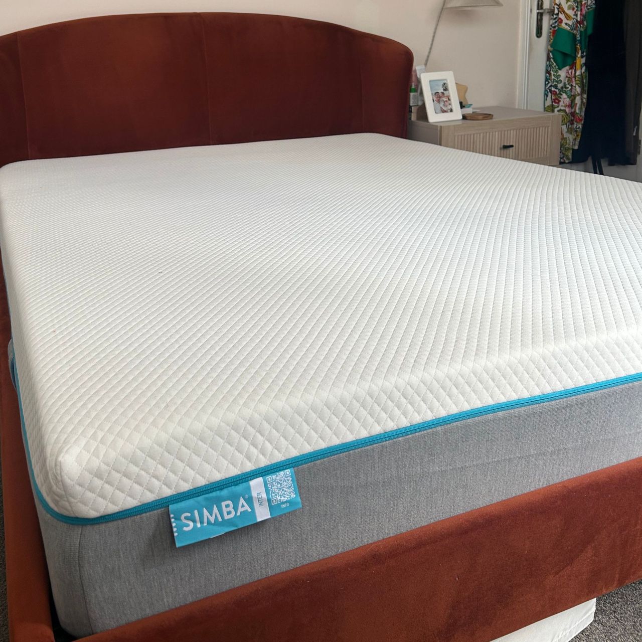 Simba mattress on red velvet bed frame