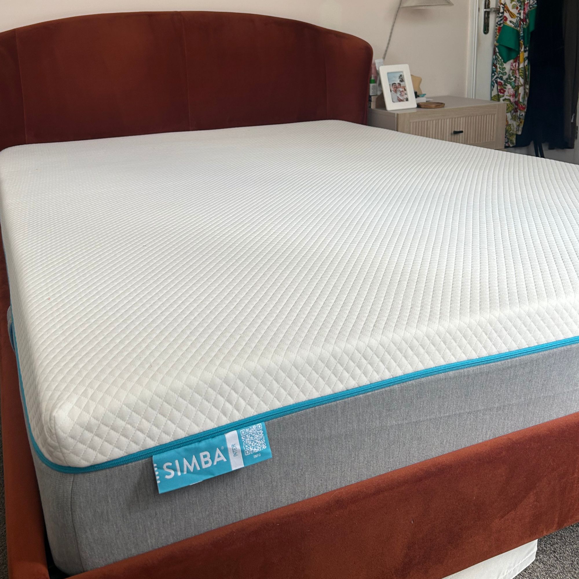 Simba mattress on red velvet bed frame