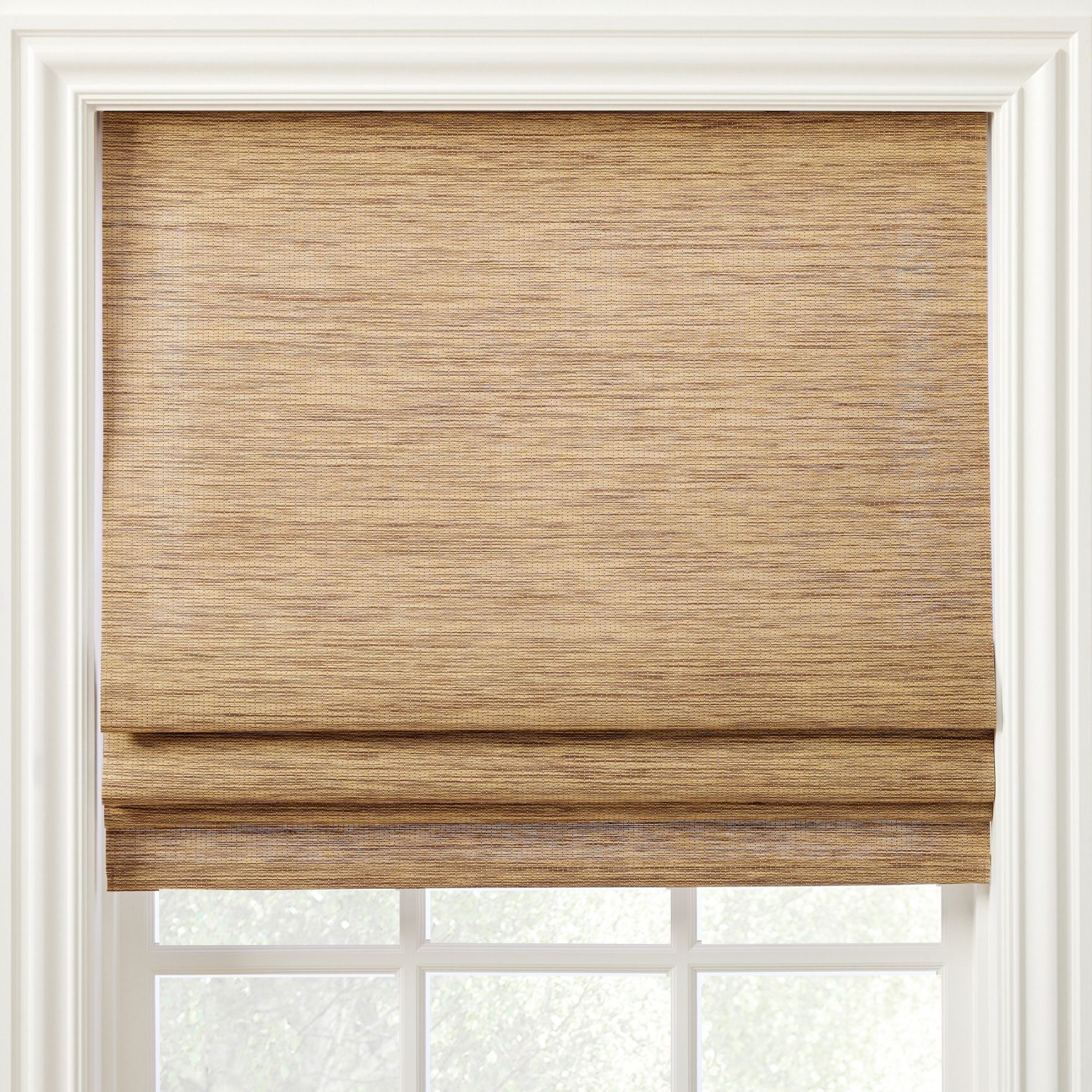 a naturally textured shade in front of a window