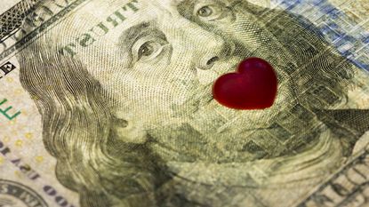 photo illustration of $100 bill with heart
