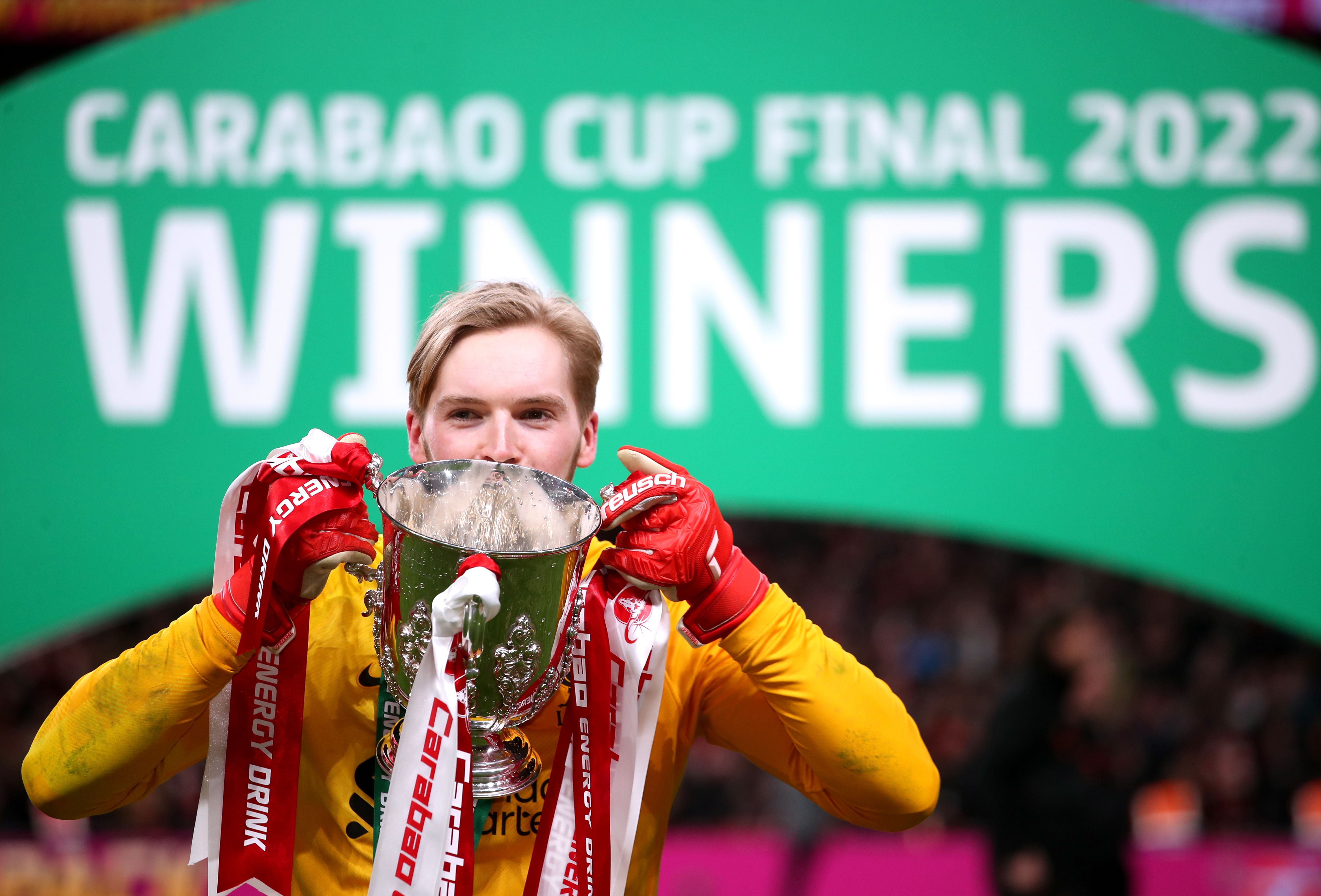 Liverpool goalkeeper Caoimhin Kelleher holds up the Carabao Cup