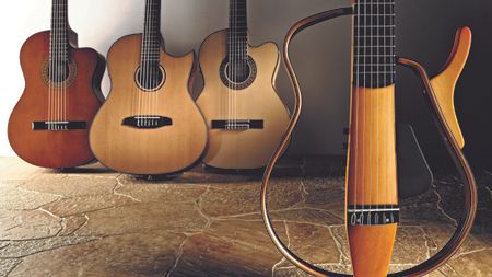 A selection of classical guitars on a stone floor