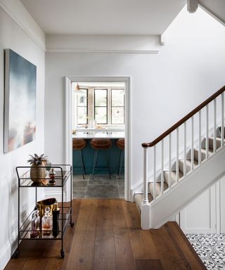 Hallway with white walls and drinks trolley