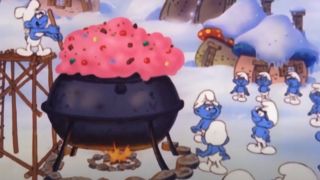 The Smurfs gather around a bunch of holiday pudding.