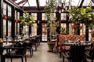 The conservatory dining room at The Maker hotel in Hudson, New York