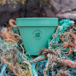 blue garden pot made from ocean waste