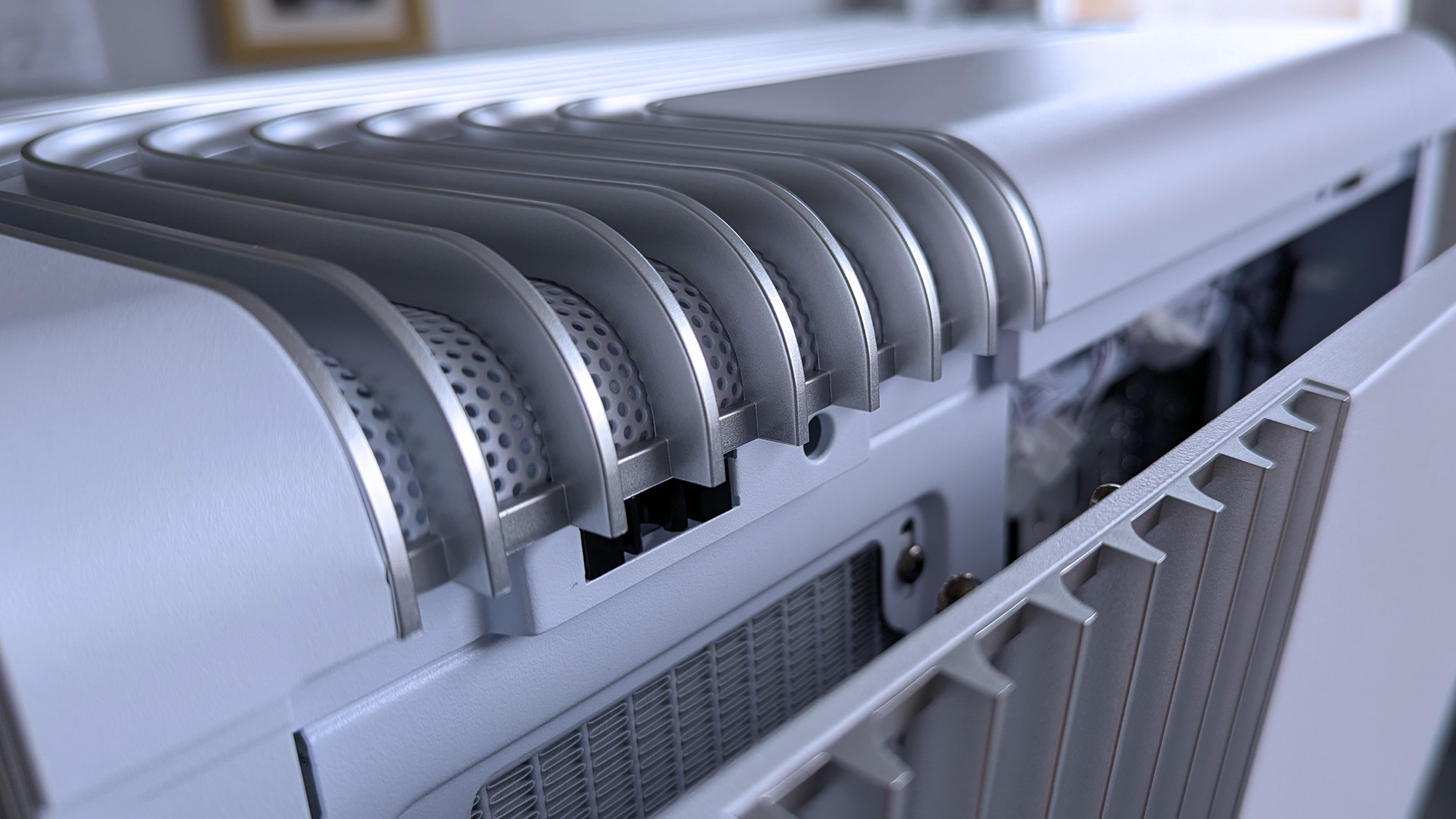 Close-up of an iBUYPOWER RDY Trace X R01 PC with metallic vents and a ridged design on a detached side panel