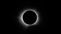 a thin white line of wispy light on a black background