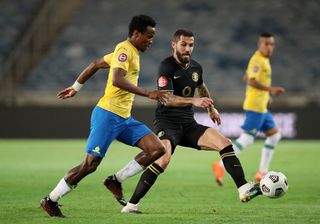 Daniel Cardoso challenging Themba Zwane for the ball