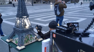 Lego Eiffel Tower toy photographer