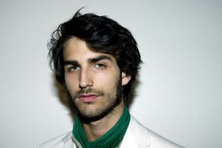 male model head shot with dark hair and short beard