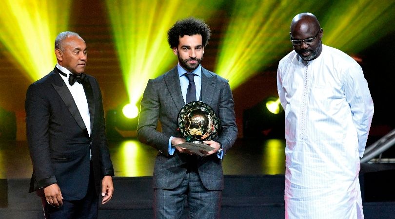 Liverpool&#039;s Mohamed Salah receives the African Footballer of the Year award alongside former Ballon d&#039;Or winner George Weah in 2019.