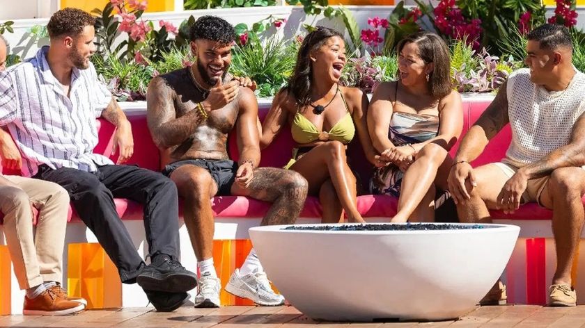&#039;Love Island USA&#039; season 7 contestants gathered on a sofa in the villa.