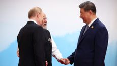 Russia's Vladimir Putin, India's Narendra Modi and China's Xi Jinping hold hands in Chinese summit