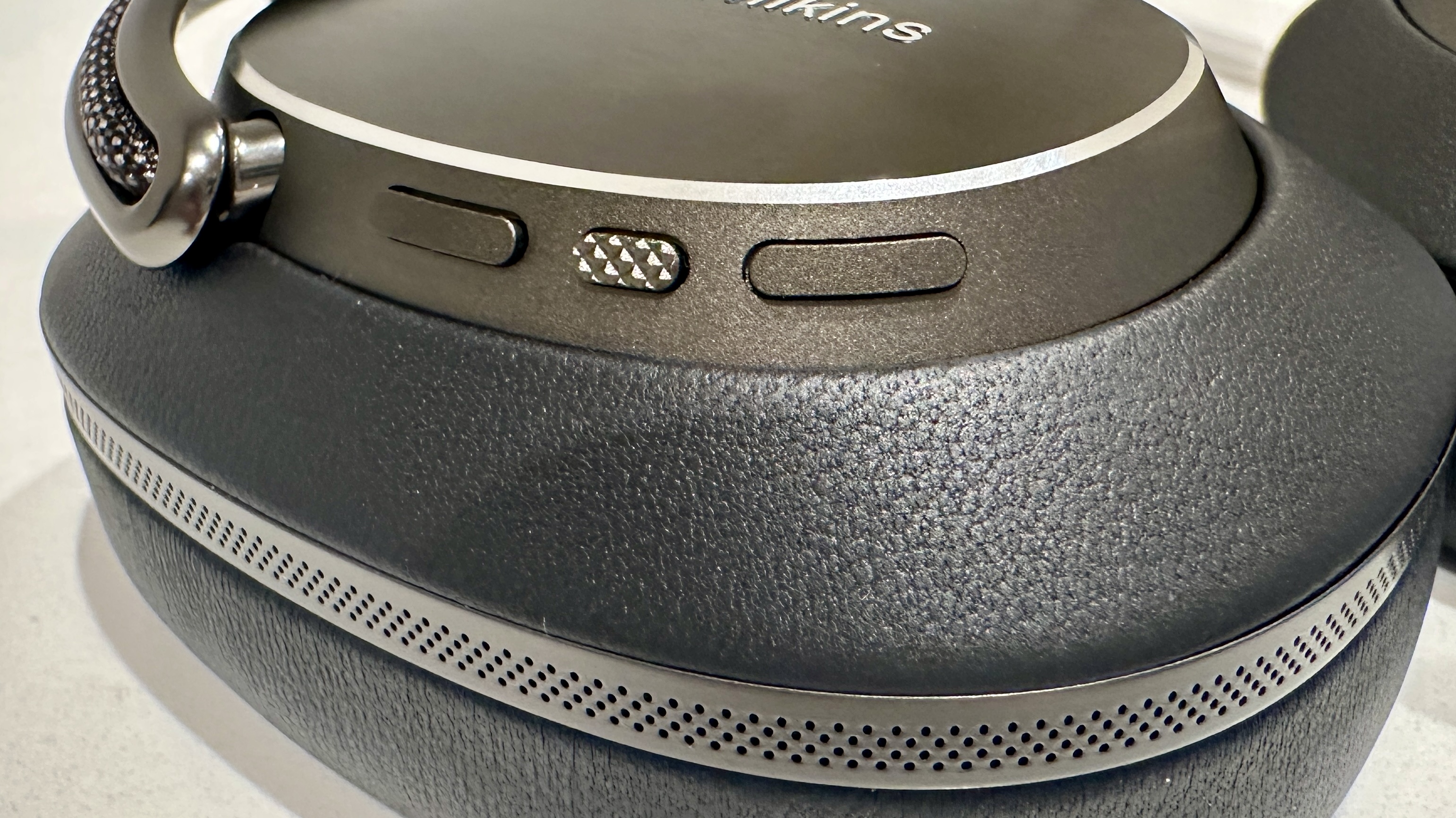 Control buttons on the earcup of the Bowers &amp;amp; Wilkins Px8 S2 over-ear headphones