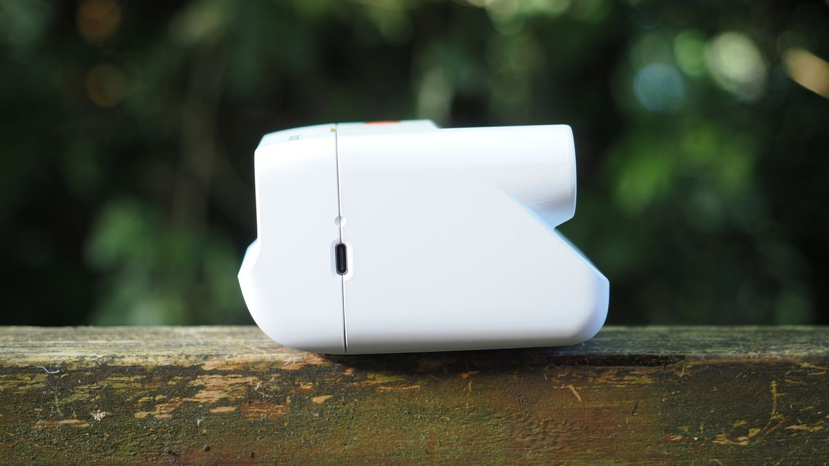 Polaroid Go Gen 3 on a wooden surface outdoors