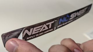 Peeling the adhesive cover off of a NoSweat liner