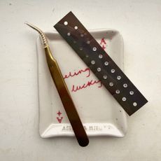 At home acupressure: Health writer Ash S with at home ear seeds, acupressure mat, and more