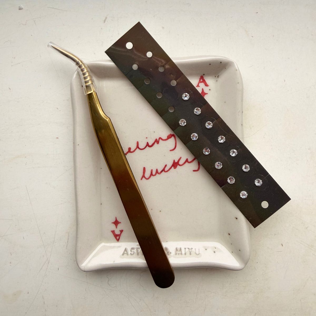 At home acupressure: Health writer Ash S with at home ear seeds, acupressure mat, and more