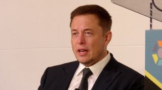 Elon Musk speaks at the ISS Research and Development Conference in Washington July 19.