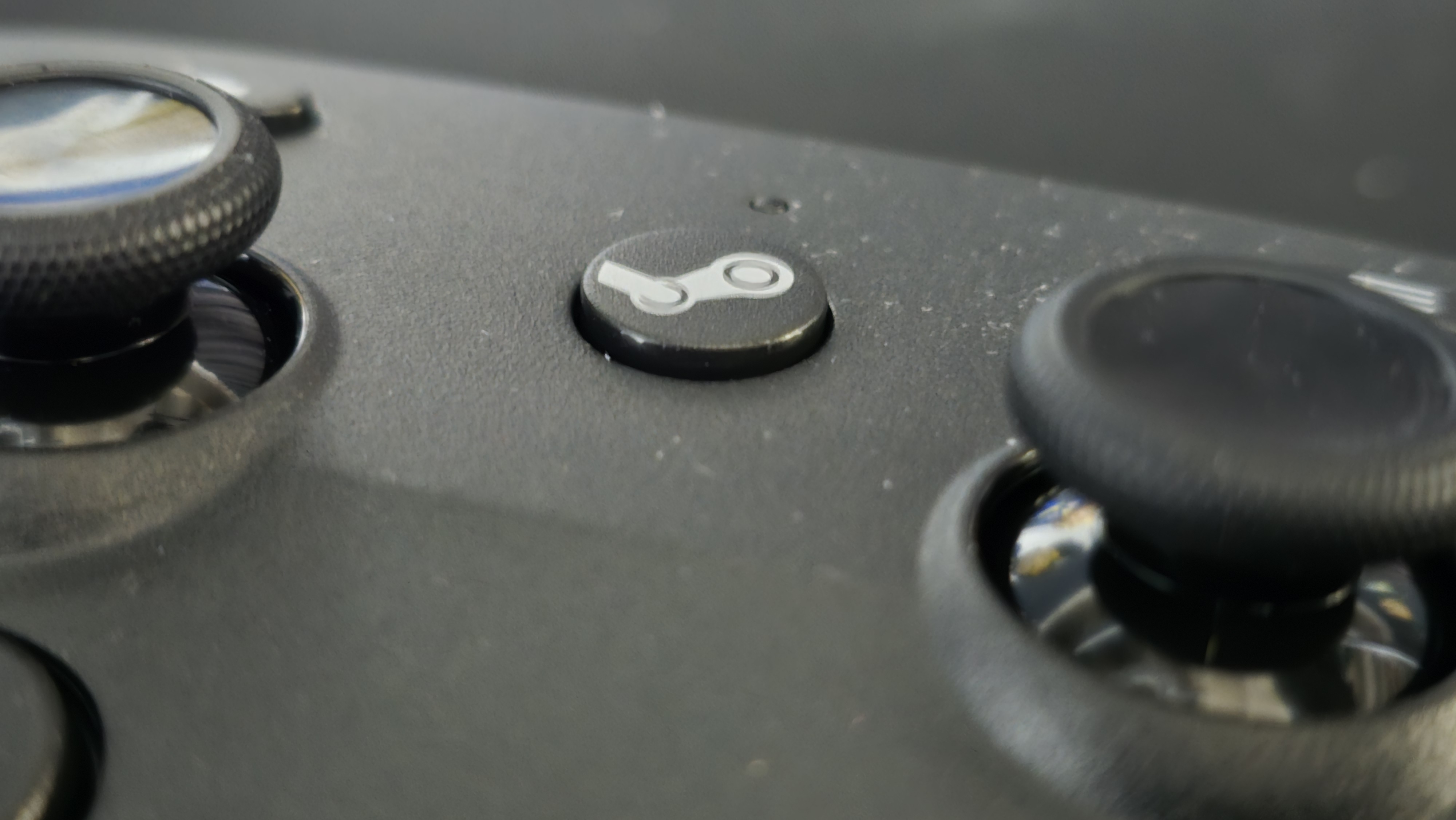 back of Valve Steam Controller (2026) on gamer desk