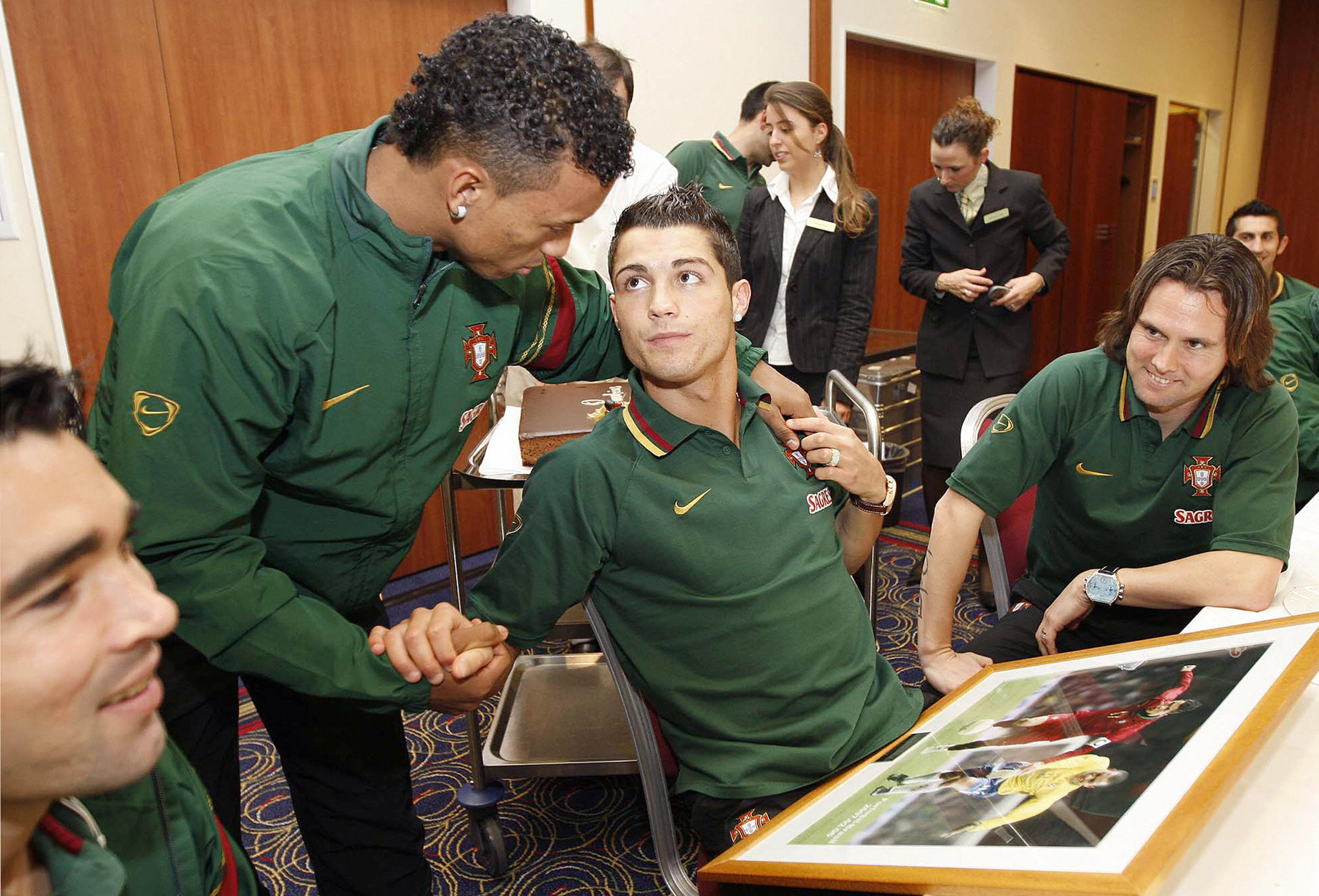 Cristiano Ronaldo (centre) is congratulated by Portugal team-mates on his 23rd birthday, ahead of a game against Italy, in February 2008.