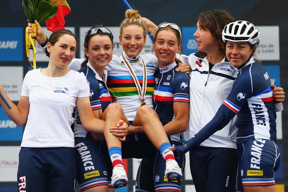 Pauline Ferrand Prevot lifted up by her teammates after winning the 2014 World Championships