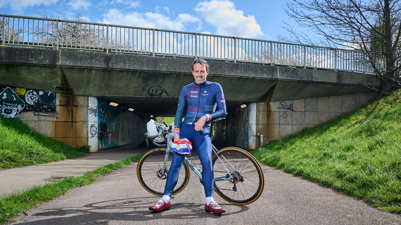 Alex Dowsett leaning on his bike