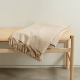 beige blanket with tassel edge