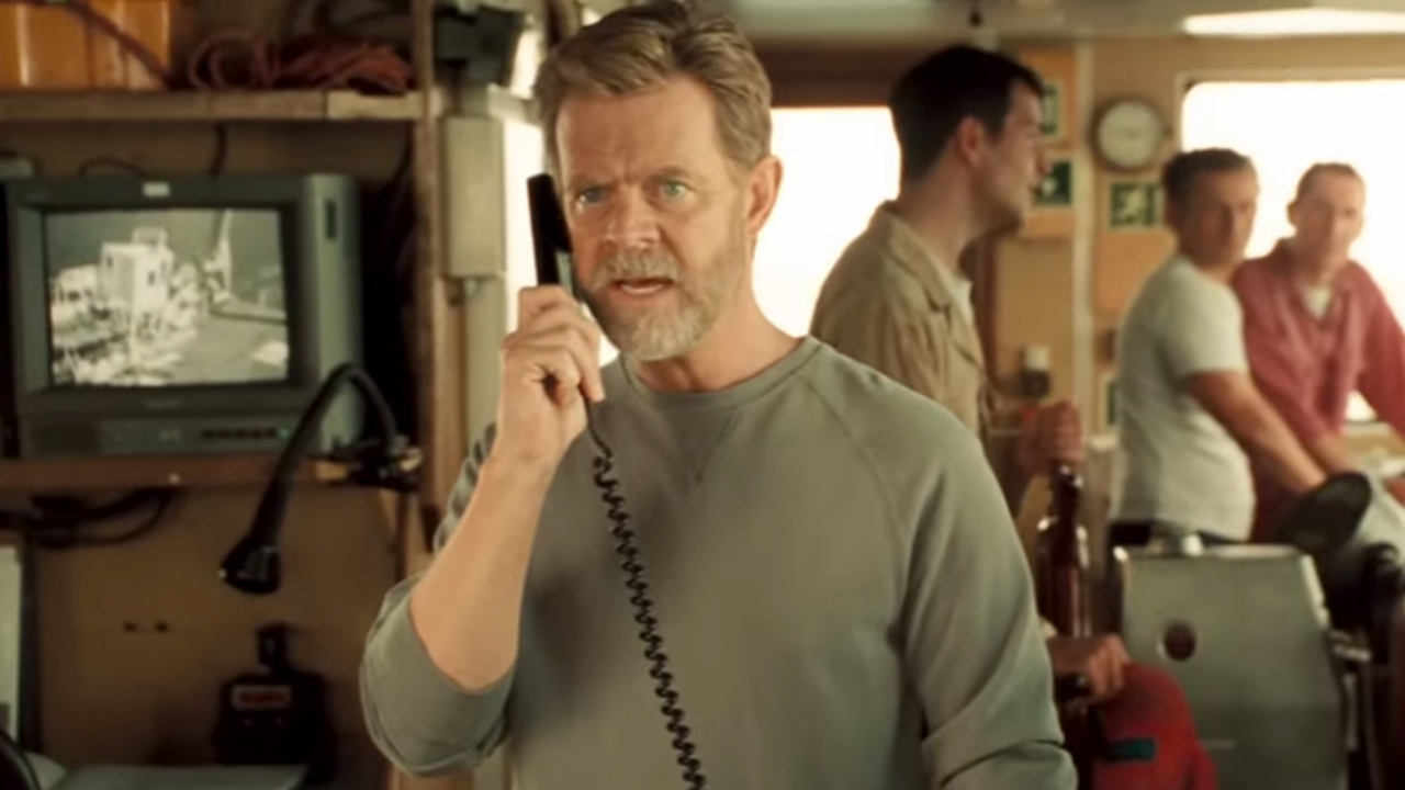 William H. Macy talking on the phone in Sahara
