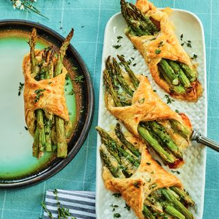 asparagus and brie tarts on plates