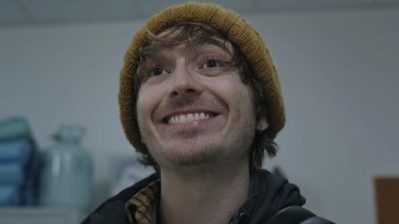 Bryan smiling widely at hospital worker in Resident Evil