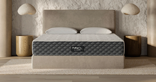 Image shows a Puffy Cloud mattress on a beige fabric bedframe