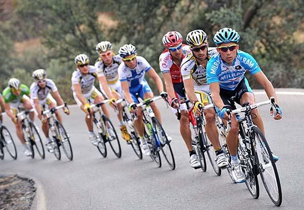 Riders from several teams at the front of the main bunch.