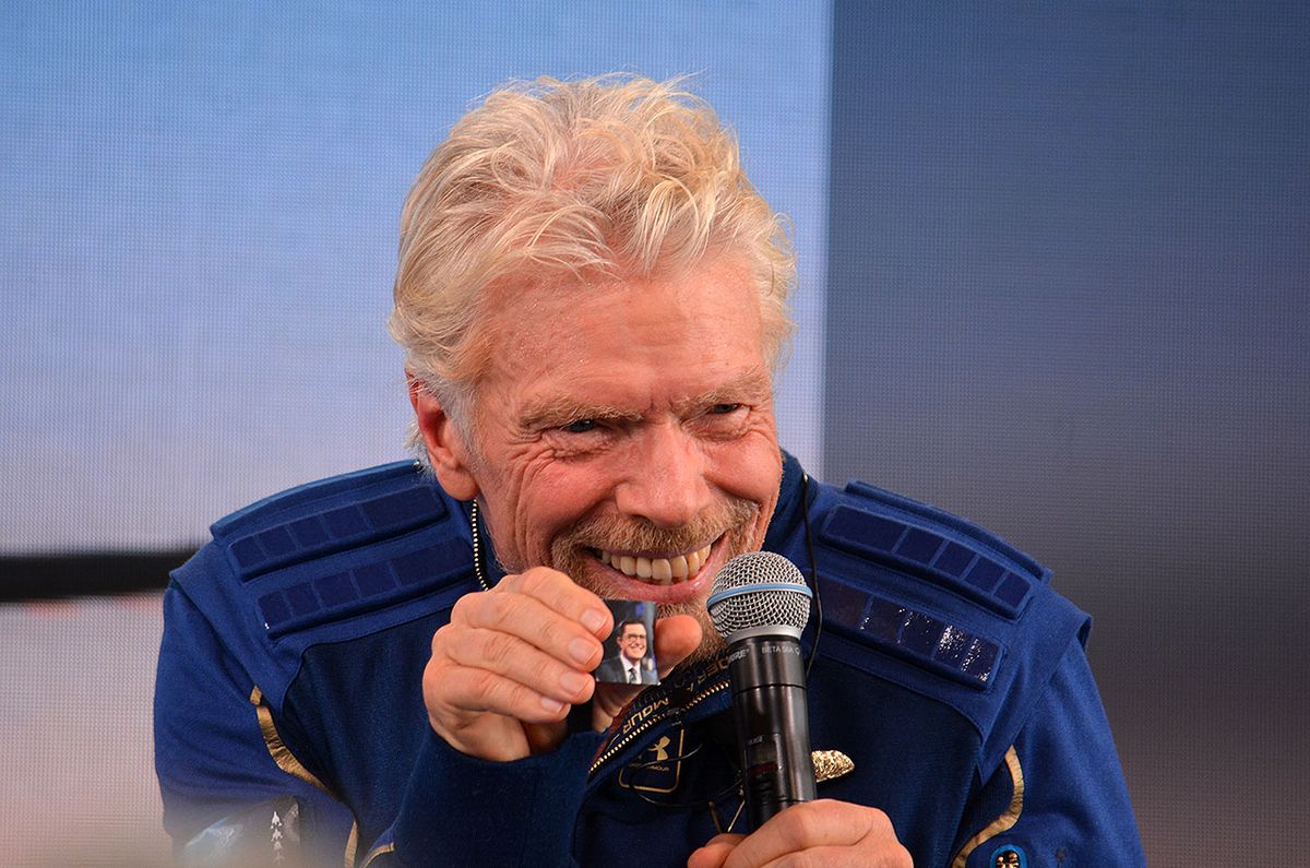 Virgin Galactic founder Richard Branson displays the headshot of comedian Stephen Colbert that he carried to space on the Unity 22 suborbital mission on Sunday, July 11, 2021. 